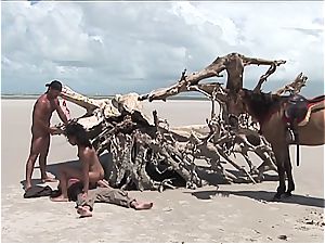 insatiable latin woman gets 2 pricks on the beach